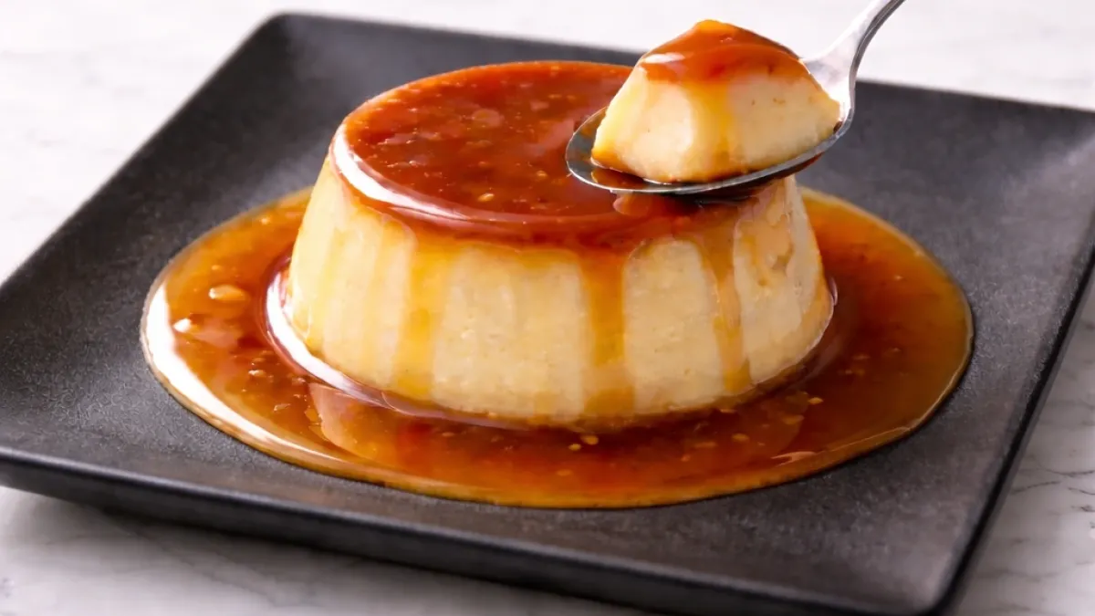 Crème caramel dessert with silky custard and flowing caramel sauce, showing smooth baked texture for elegant serving