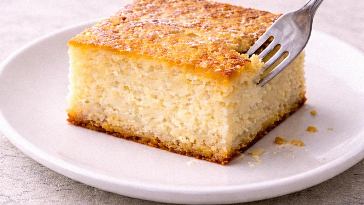 A cut square of cottage cheese tray bake on a white plate