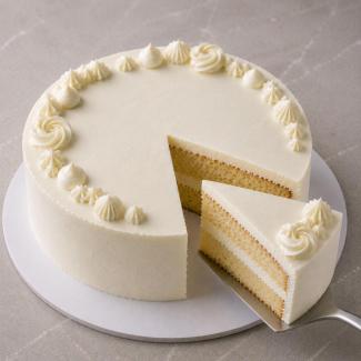 Stable mascarpone cream holds sharp piping and a clean moist cake slice without weeping