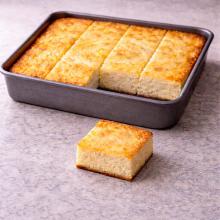 First sliced piece of cottage cheese tray bake
