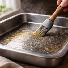 Warm tray with light oil sheen, no smoke, heat shimmer visible, dry surface