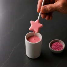 A molded cake pop drains slowly with thin coating, covered edges and a straight stick
